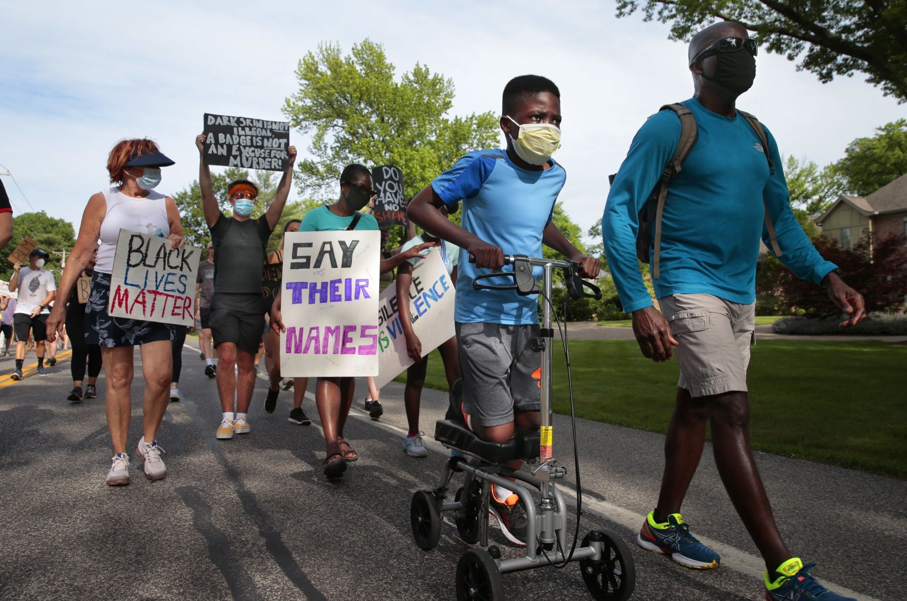 Youth march moves through wealthy suburbs